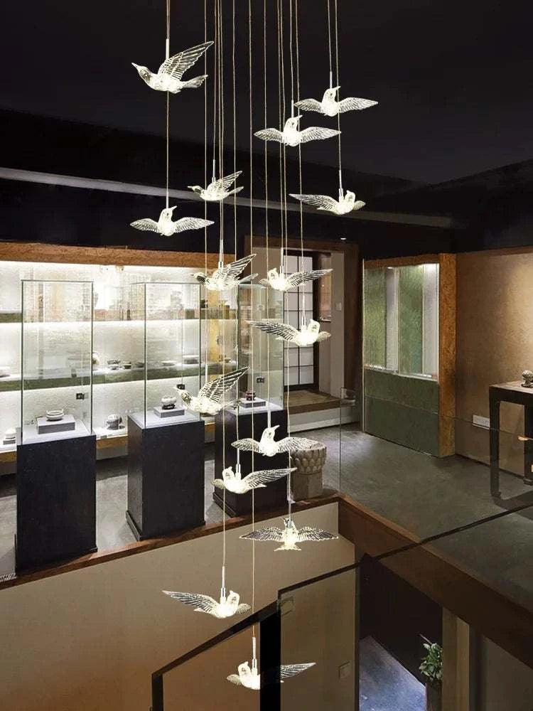 Chandelier with bird-shaped lights in a modern interior setting