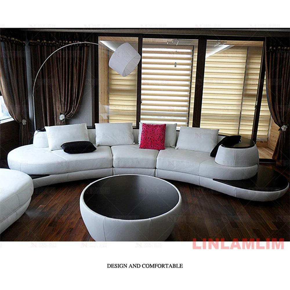 Modern living room with a white sectional sofa and stylish coffee table.