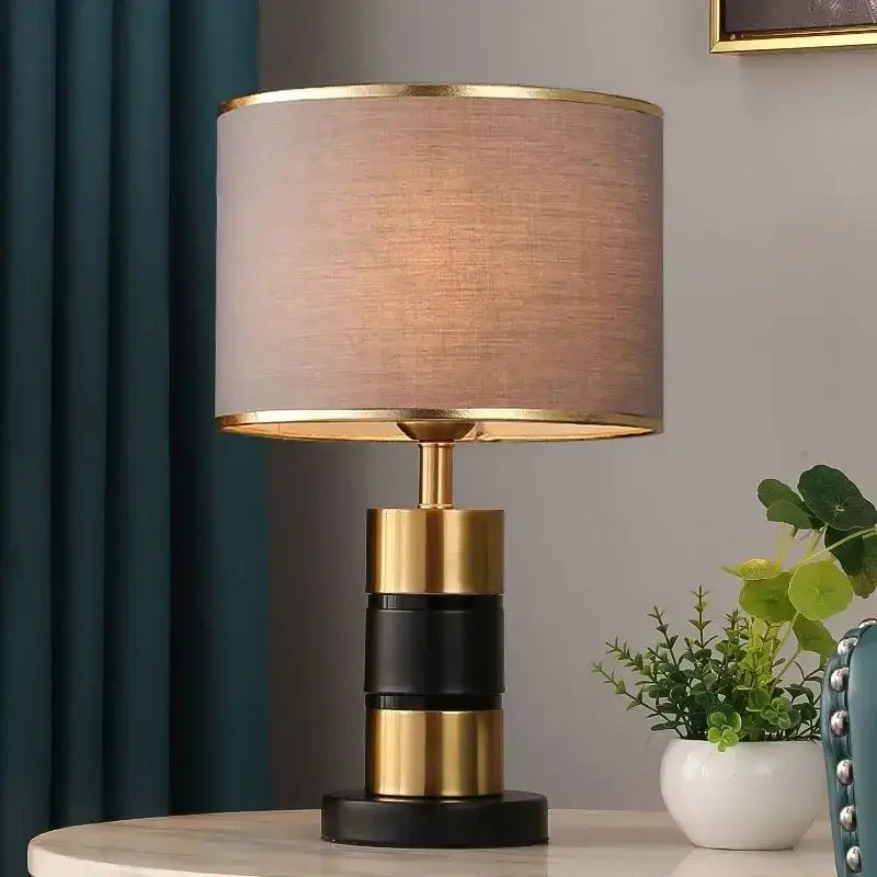 Luxury LED bedside lamp with gold frame and fabric shade enhancing modern decor.