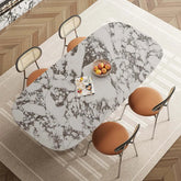Dining table with marble pattern and chairs on a wooden floor