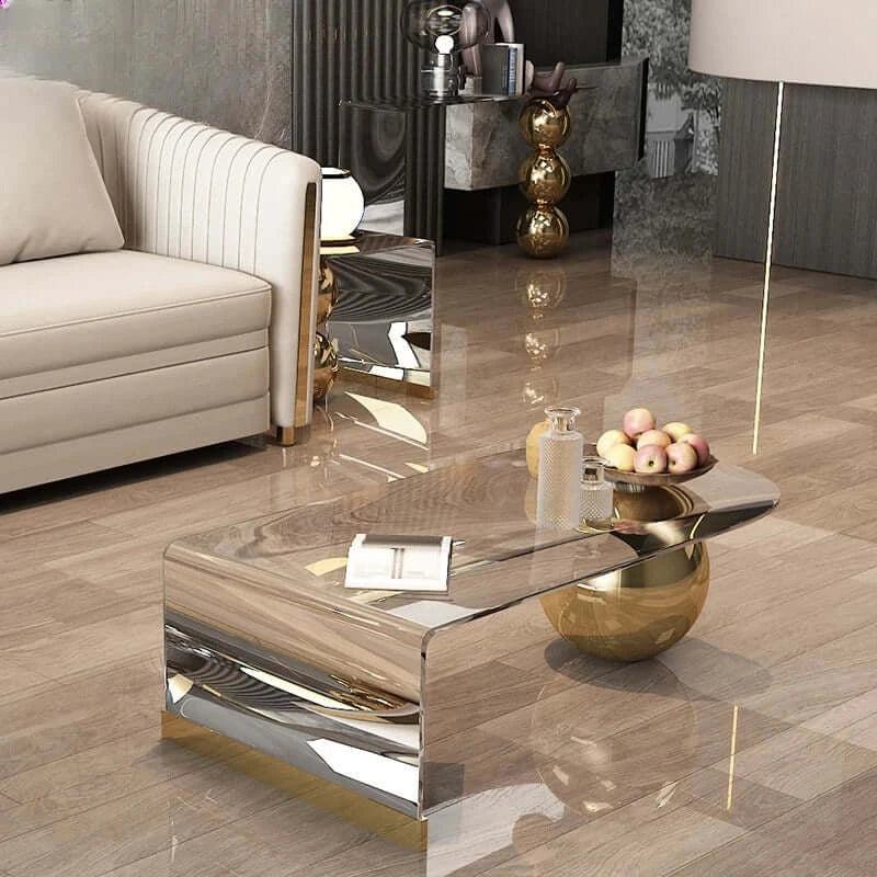 Modern living room with a stylish coffee table and decorative items.