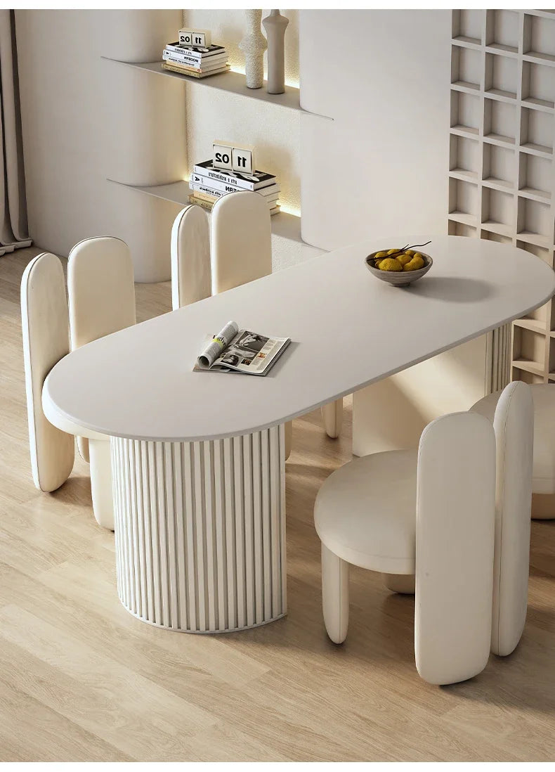 Art-Style rock slab dining table set with sleek carbon steel frame and modern curved chairs.