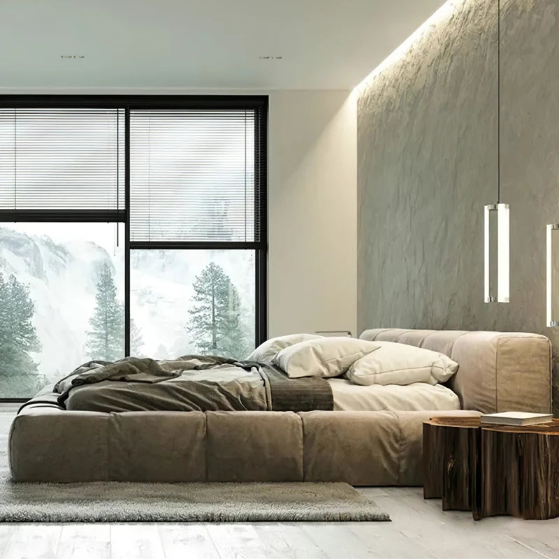 Italian upholstered bed frame in a modern bedroom with large windows and natural light.