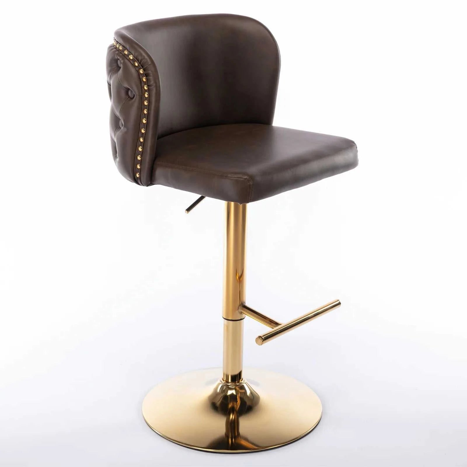 Brown leather bar stool with gold metal base on a white background