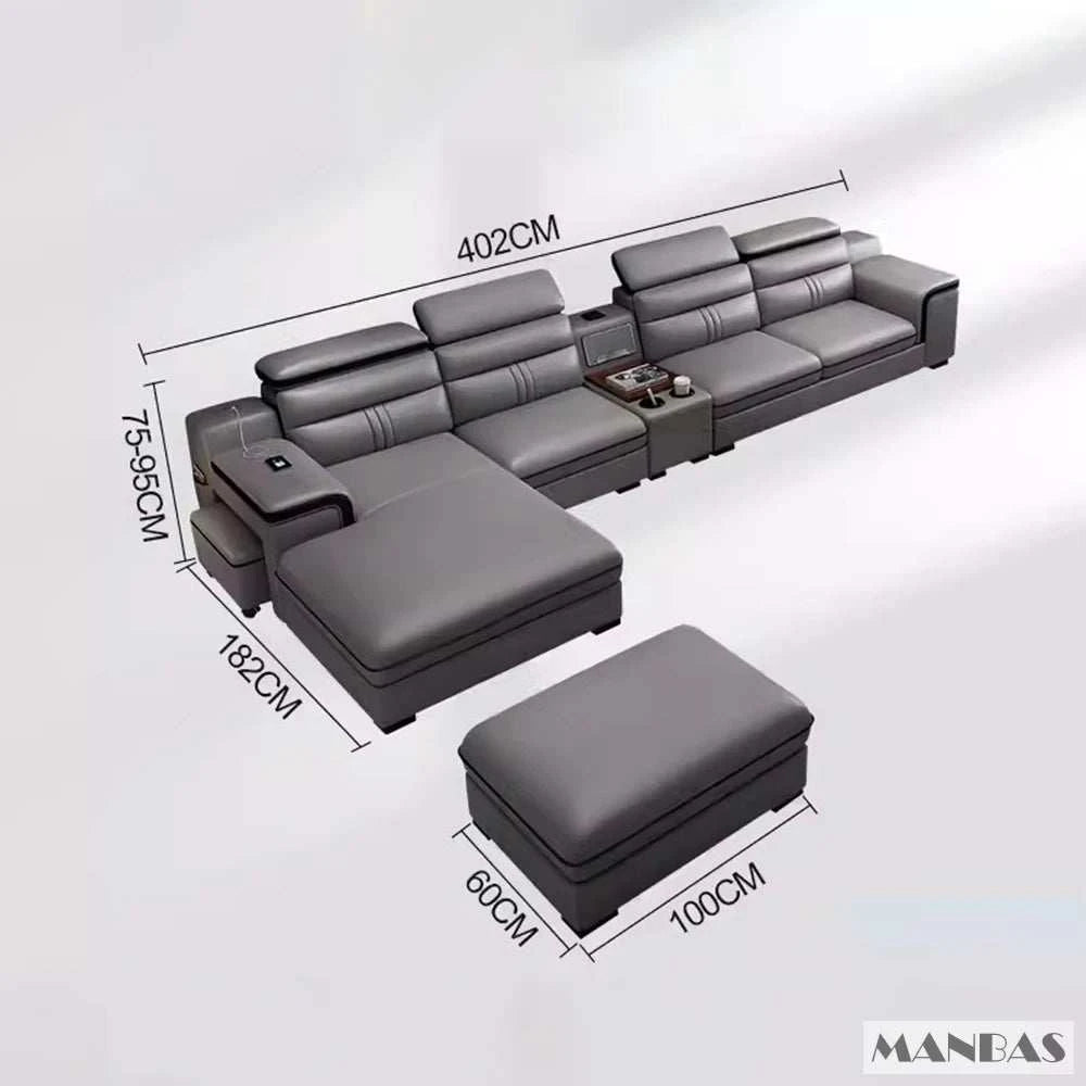 Gray sectional sofa with ottoman and dimensions on a white background, featuring the brand 'MANBAS'.