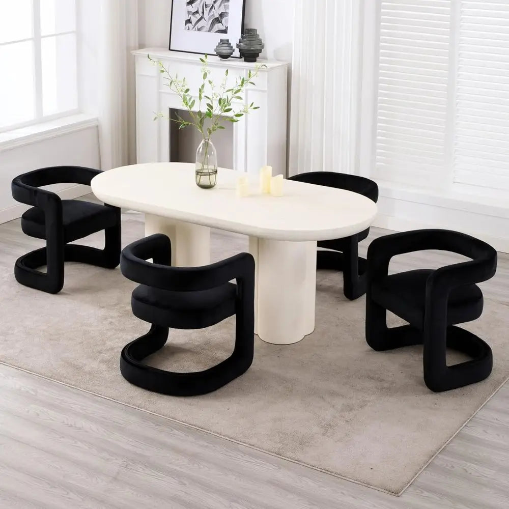 Modern dining table with black chairs in a minimalistic room.