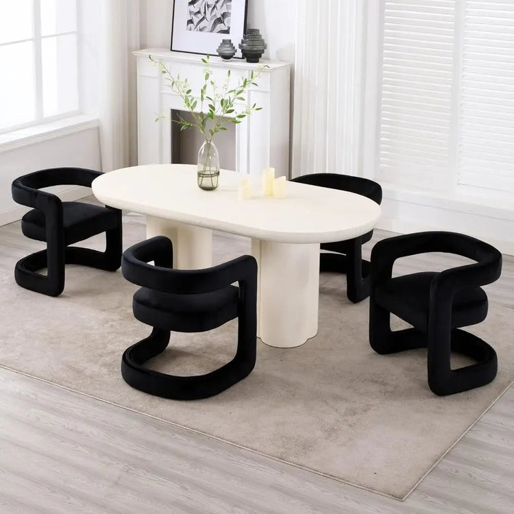 Modern dining table with black chairs in a minimalistic room.
