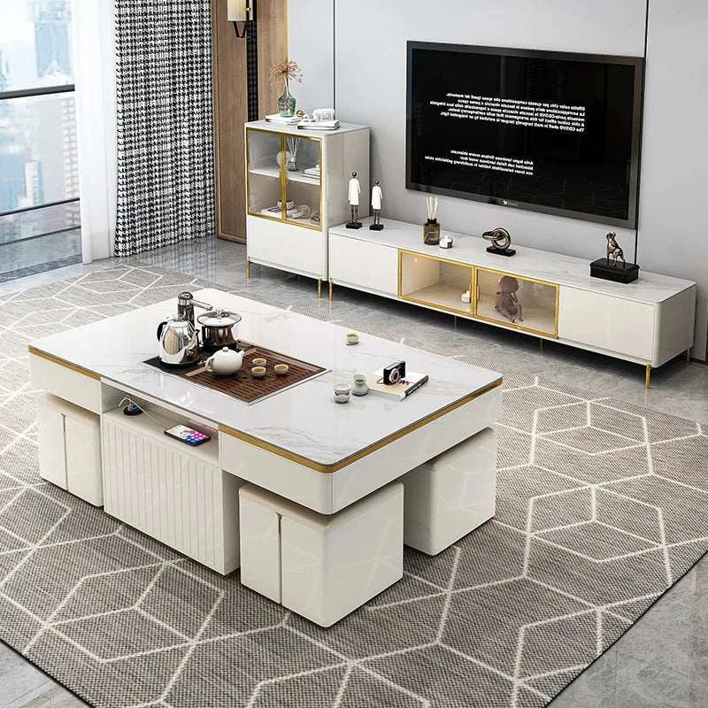 Modern living room with a white entertainment console, coffee table, and television.