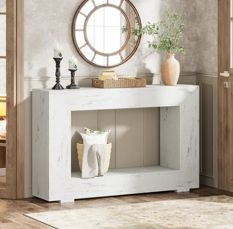 White wooden console table with decorative items in a room setting.