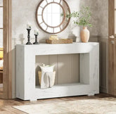 White wooden console table with decorative items in a room setting.