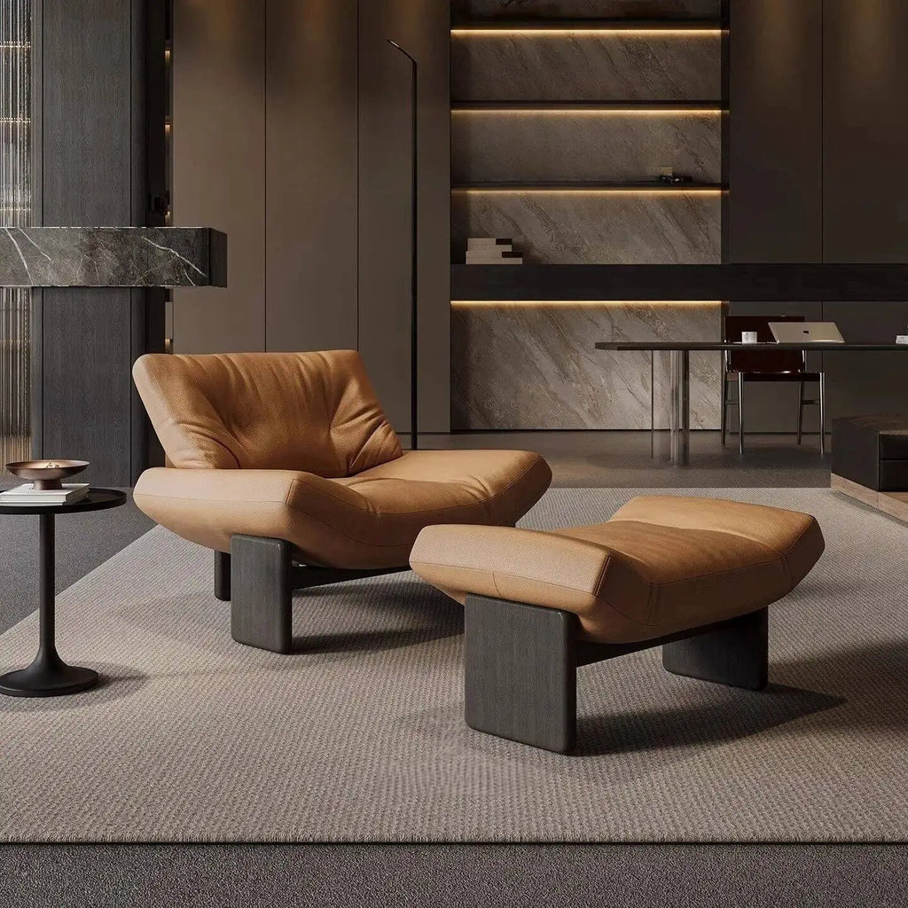 Modern brown leather lounge chair with ottoman in a stylish room.