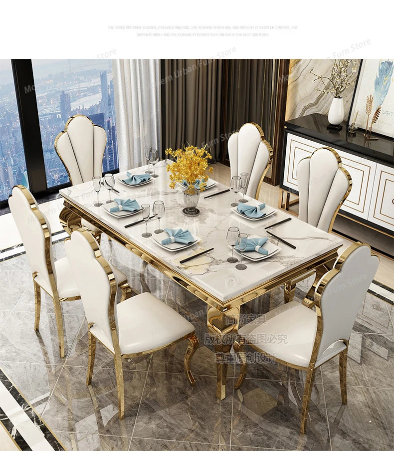 Dining table set with marble top and gold legs in a modern room.