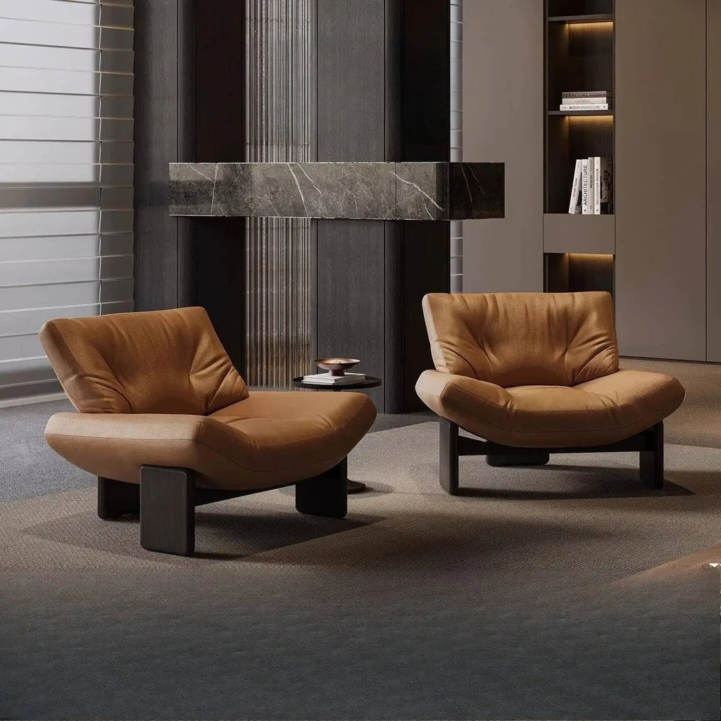 Italian leather single seater sofa chair in a modern living room setting with elegant design.