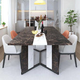 Large rectangular white dining table with marble color and stylish modern chairs in bright dining space.
