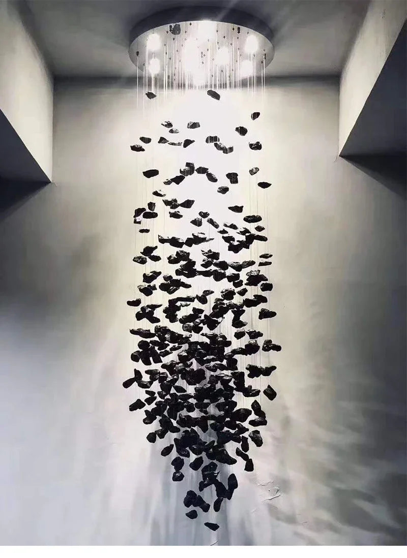 Modern shower head with black decorative elements in a bathroom setting