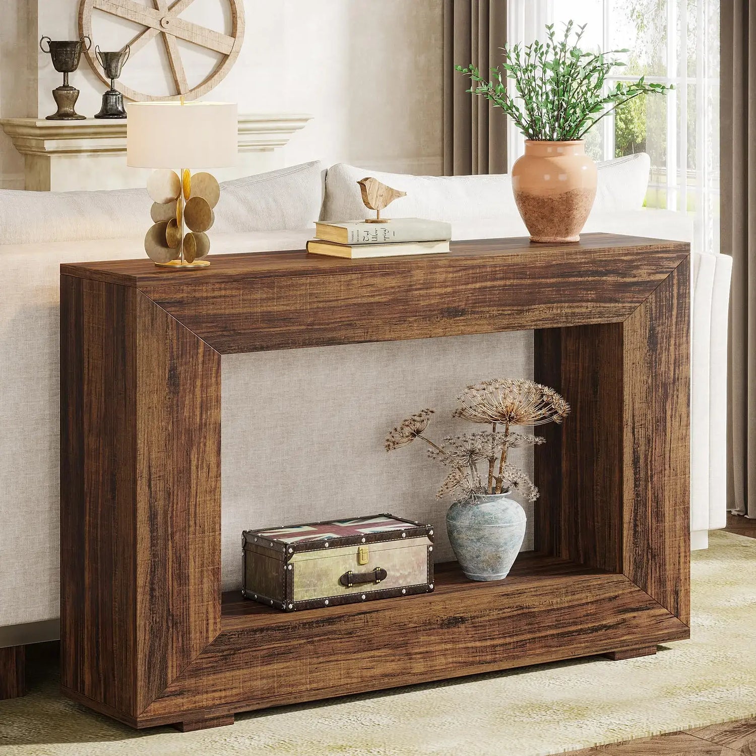 Wooden console table with decorative items in a living room setting