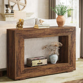 Wooden console table with decorative items in a living room setting
