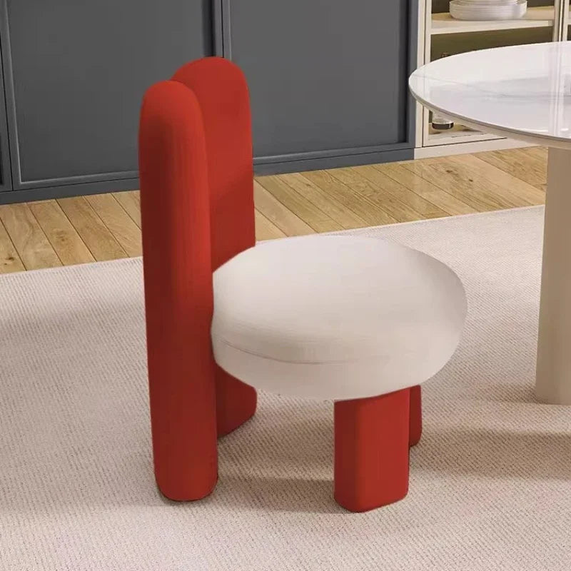 Artistic red and white chair featuring a unique design, part of the Art-Style Rock Slab Dining Table Set.