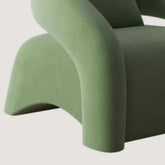 Green chair with a modern design on a light gray background