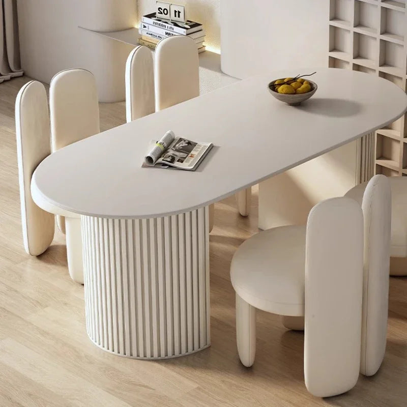 Art-Style rock slab dining table set featuring a sleek design with two stylish chairs in a modern interior.
