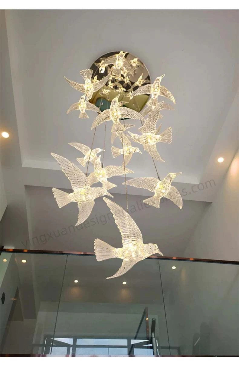 Chandelier with bird design hanging from a ceiling
