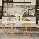 Round dining table with wooden marble pattern top and gold base in modern kitchen setting