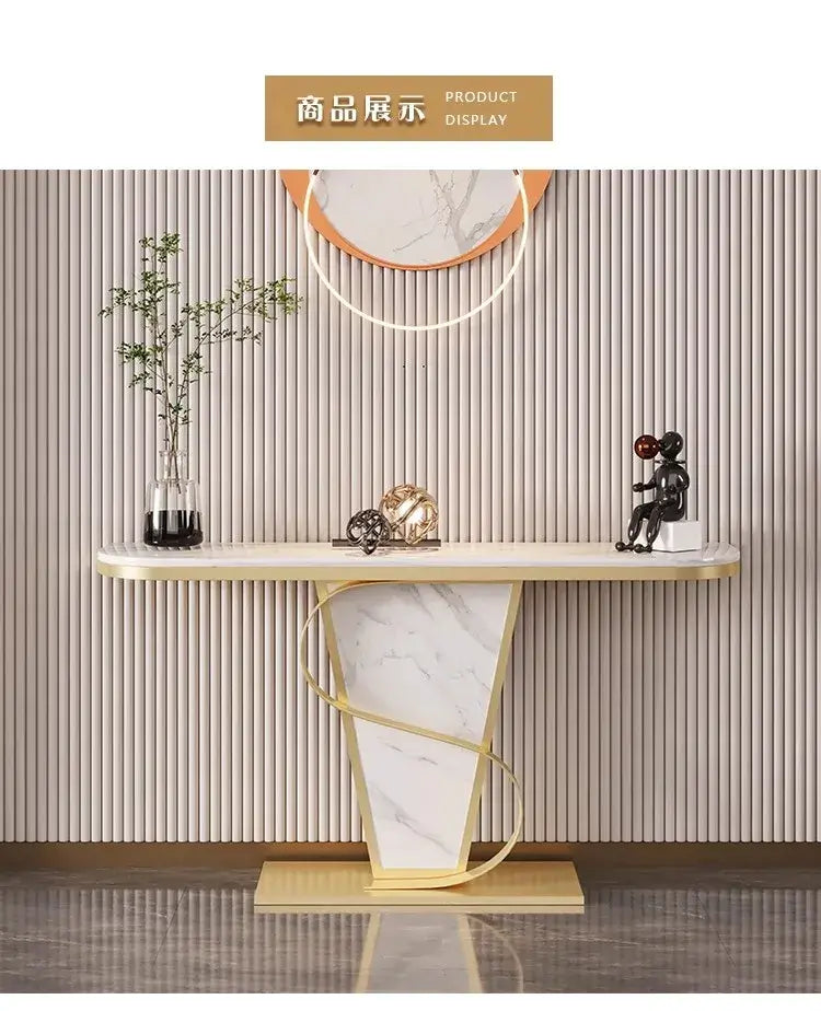 Decorative console table with marble base and gold accents against a striped wall.