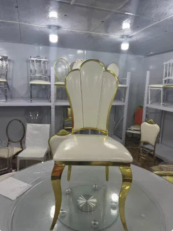 Decorative chair with gold accents in a showroom setting