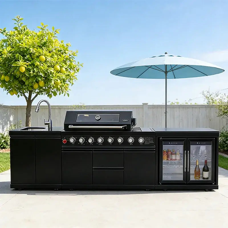 Stainless steel outdoor kitchen on wheels featuring a grill, sink, and refrigerator, perfect for backyard patio cooking.