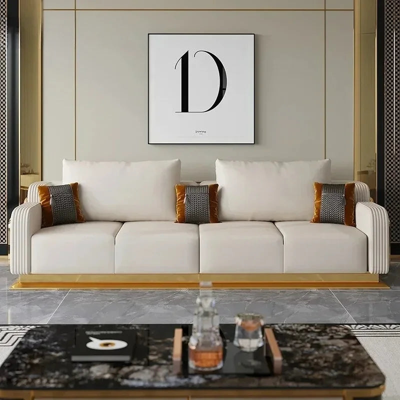 Modern living room with a beige sofa, decorative pillows, and a coffee table.