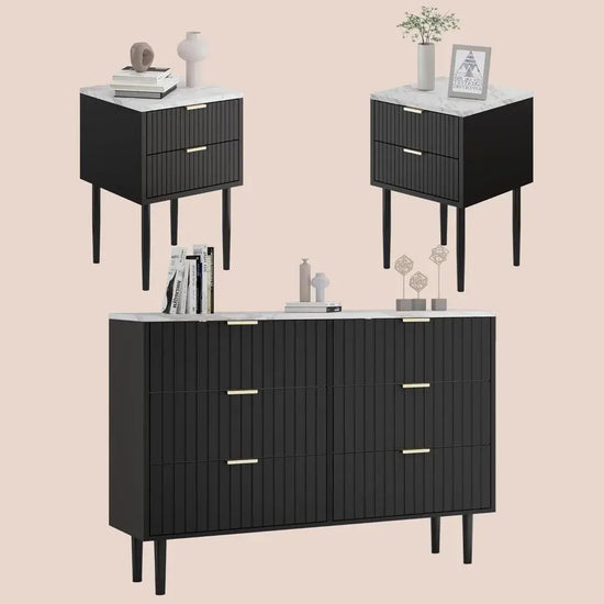 Black dresser with marble top and two matching nightstands on a beige background