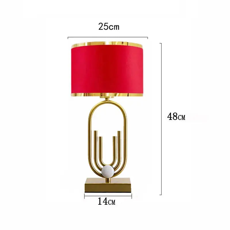 Nordic luxury bedside lamp with red shade and gold accents, ideal for creating warm ambiance in homes.
