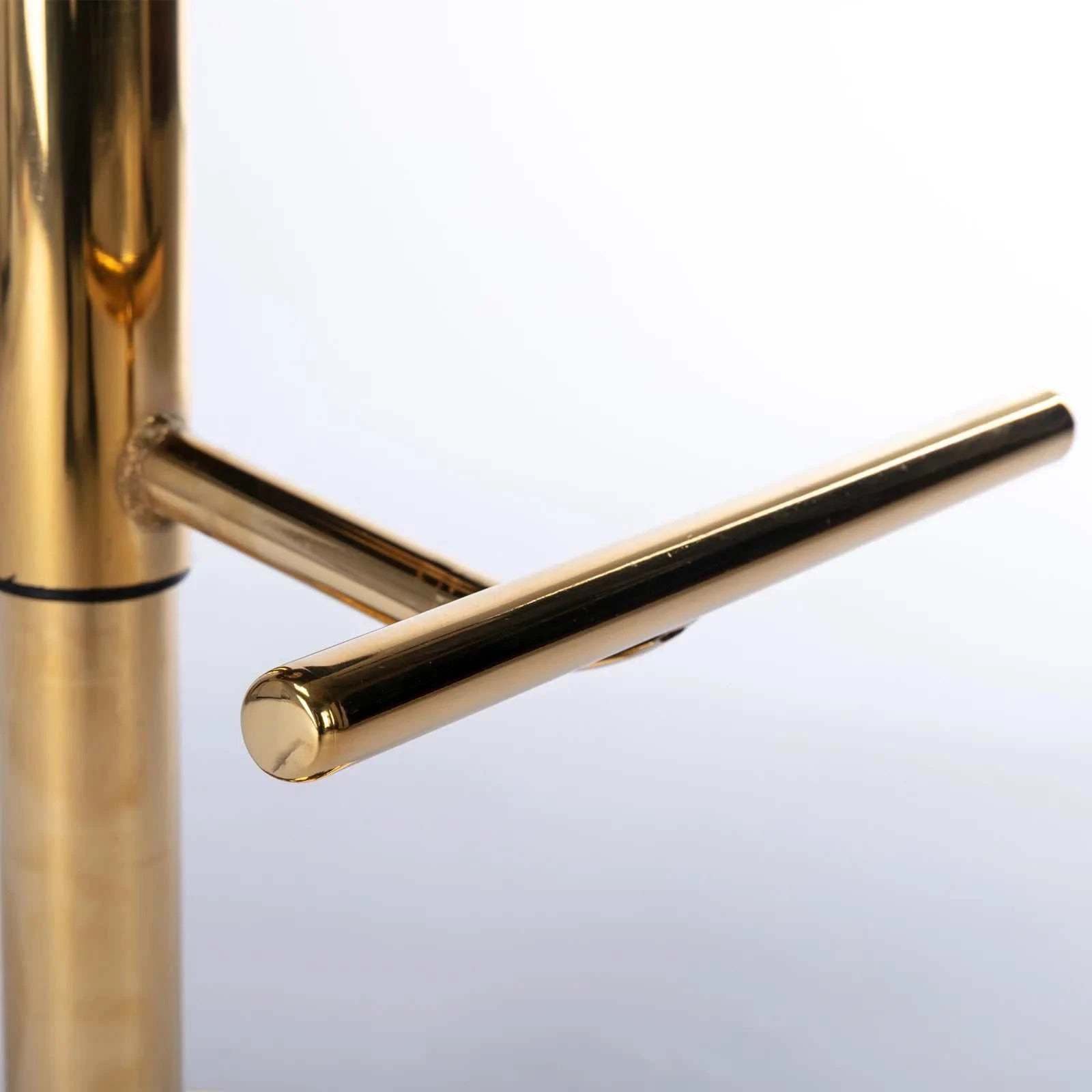 Gold lowering latch on a white background