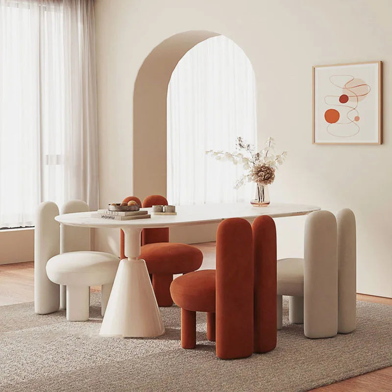 Stylish rock slab dining table set with unique chairs in a modern interior, showcasing elegant art-style design.