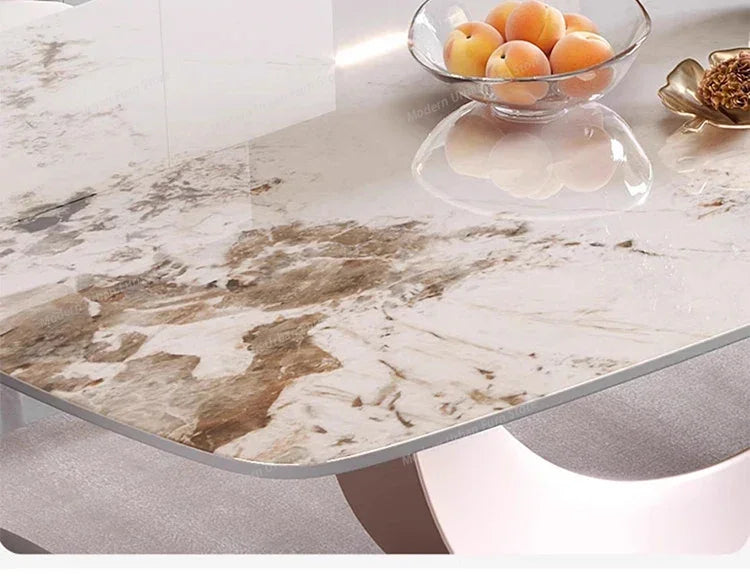 Luxury Nordic dining set with elegant slate tabletop, showcasing minimalist design and fruit bowl.