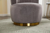 Modern swivel barrel chairs featuring soft gray velvet upholstery and a gold-accented base.