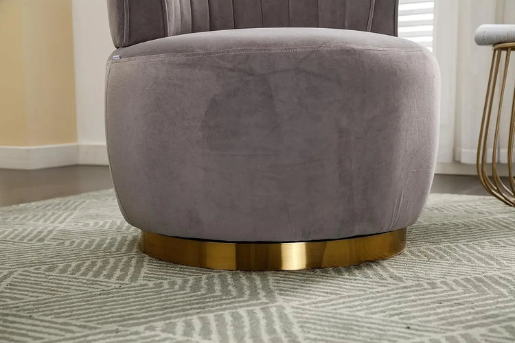 Modern swivel barrel chairs featuring soft gray velvet upholstery and a gold-accented base.