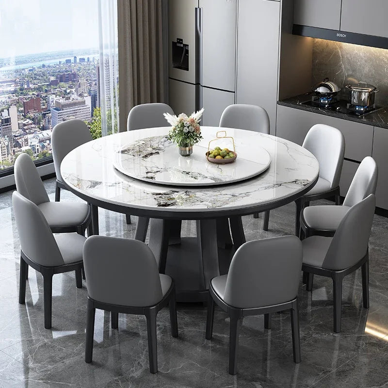 Round dining table with chairs in a modern kitchen with cityscape view