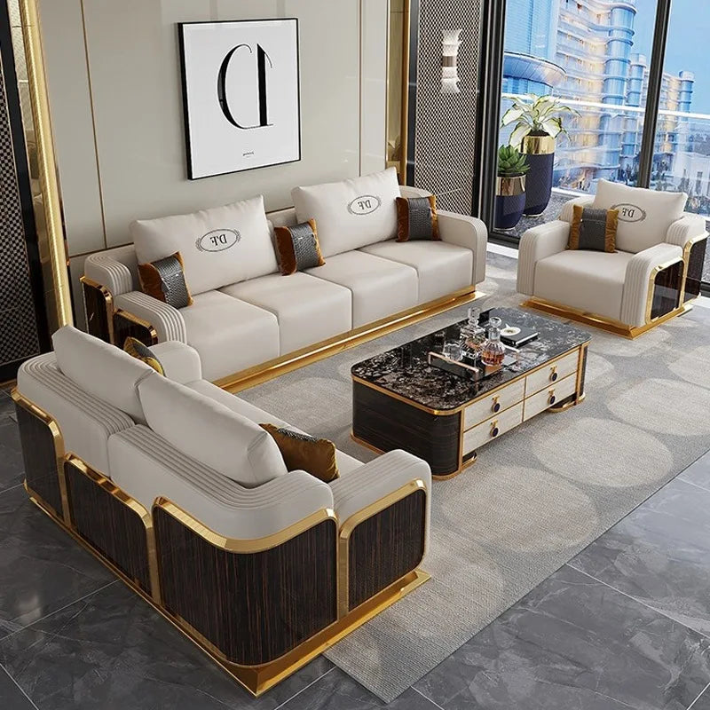 Modern living room with white and gold sofa set and coffee table.