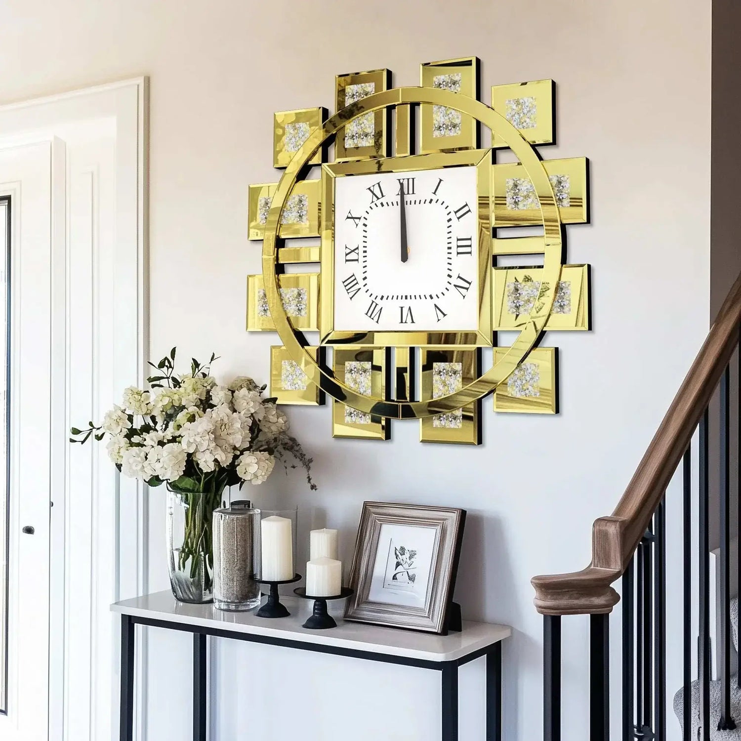 Irregular diamond mirrored wall clock stylishly displayed on a wall above a console table with flowers and decorative items.