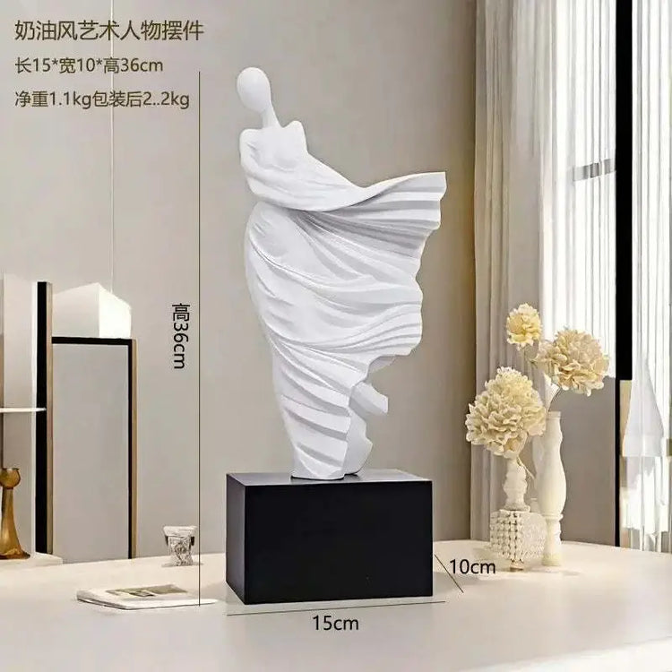White abstract sculpture on a black base with measurements indicated