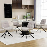 Set of 4 white swivel dining chairs set around a modern glass dining table in a stylish interior.