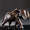 Luxury imitation wood elephant statue decoration, a stunning resin sculpture that enhances desk aesthetics with opulence.
