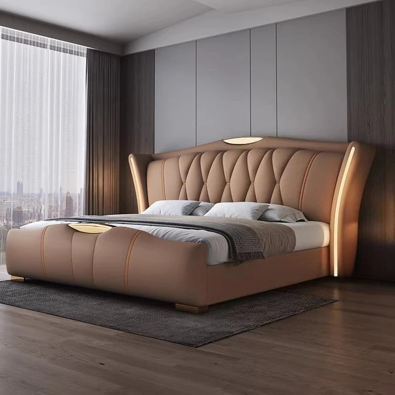 Modern bedroom with a brown upholstered bed in a well-lit room.
