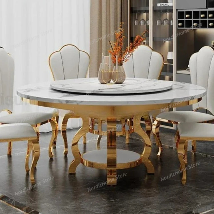 Round marble dining table with gold legs in a room setting