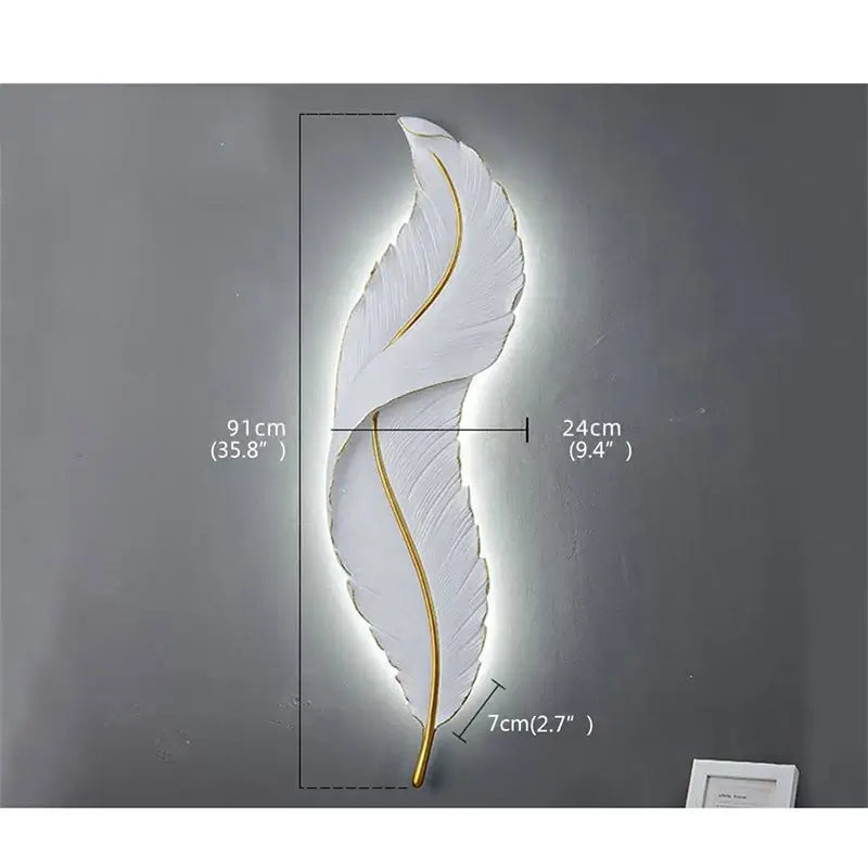 Decorative wall light shaped like a feather with measurements on a gray background
