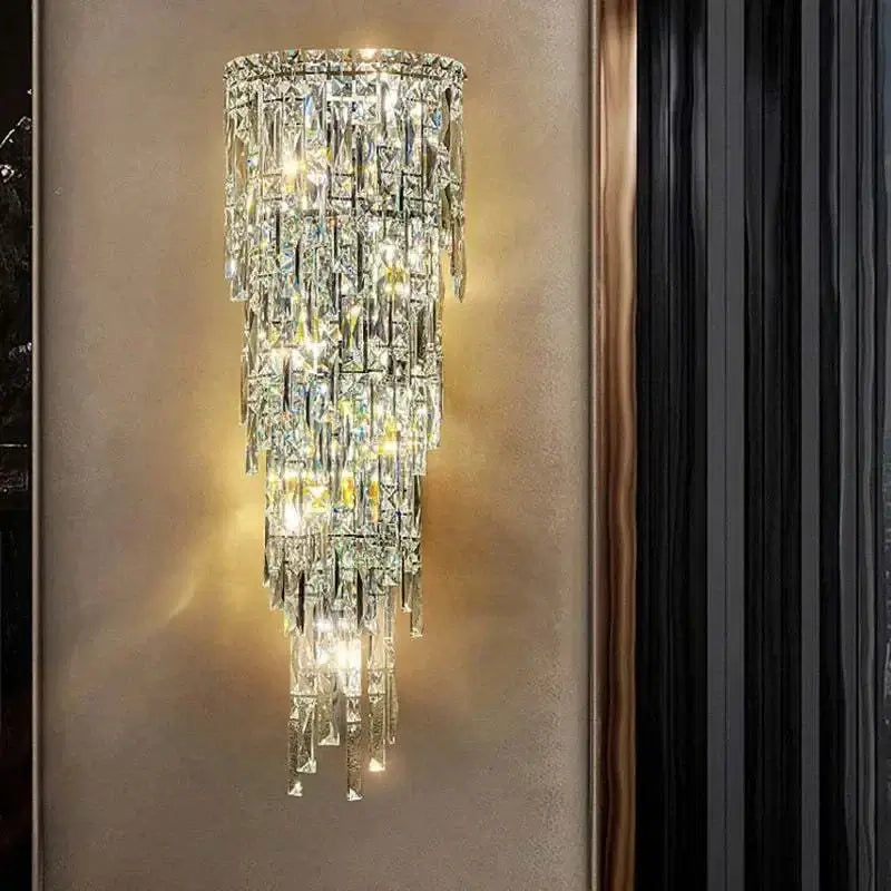 Elegant crystal wall lamp with a modern design, showcasing shimmering crystals and warm lighting in a stylish setting.