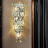 Elegant crystal wall lamp with a modern design, showcasing shimmering crystals and warm lighting in a stylish setting.