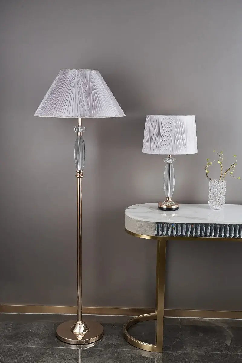 High-end crystal table lamp with fabric shade and stylish floor lamp in elegant home setting.