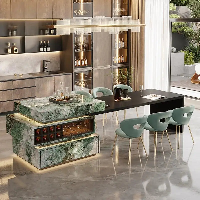 Modern kitchen with marble island, wine cooler, and dining area.